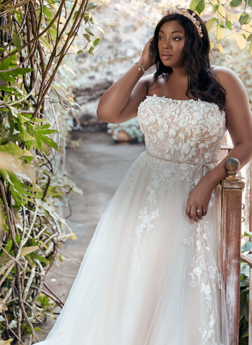 Model wearing a white Plus-Size Style Gown